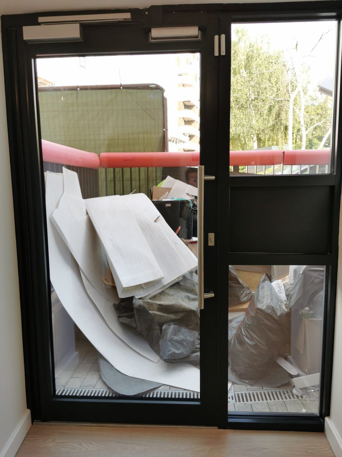 Construction debris and packaging before clearance begins