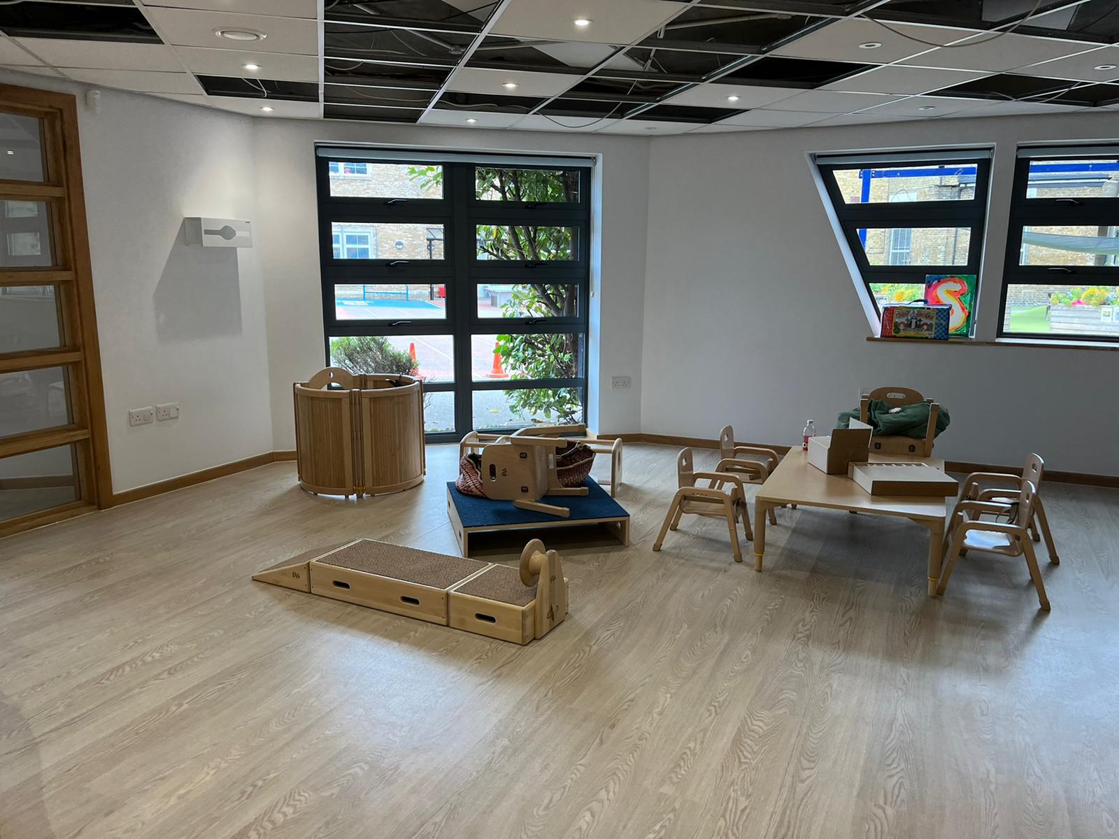 Finished nursery playroom with child-height furniture in place