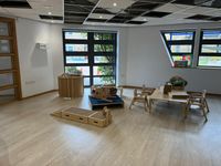 Finished nursery playroom with child-height furniture and garden view