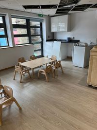 Nursery room with
        child-height tables and chairs after cleaning