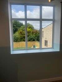 Cleaned window reveal and sill looking onto the garden